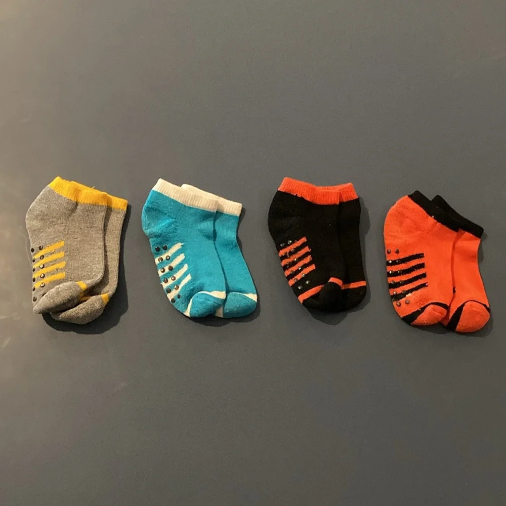 Toddler Boys socks with feet. EUC. Blue,red, yellow, black. 4 pairs